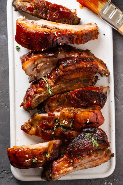 Delicious barbecued ribs seasoned with a spicy basting sauce. lose-up, copy space. stock photo