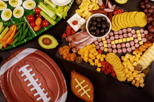 Delicious charcuterie board and veggie with dipping for championship game game. Delicious charcuterie board and veggie with dipping for championship game football game. cracker snack photos stock pictures, royalty-free photos & images