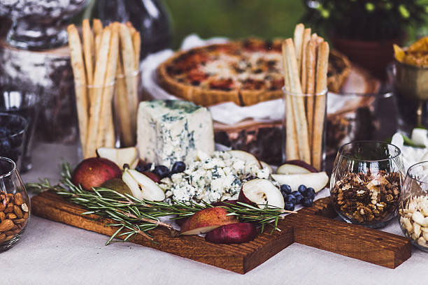 Delicious cheese plate on wedding reception stock photo