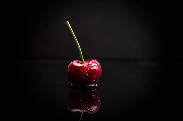 Delicious Cherry on Black Background stock photo