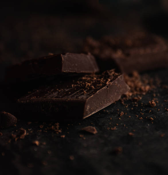 Delicious dark bitter chocolate over a black background stock photo