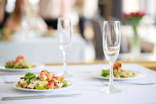 Delicious fresh salad with shrimps on restaurant table. stock photo