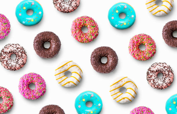 Delicious glazed donuts pattern on a white background. Top view. Flat lay. Delicious donuts pattern on a white background. Top view. Flat lay doughnut stock pictures, royalty-free photos & images