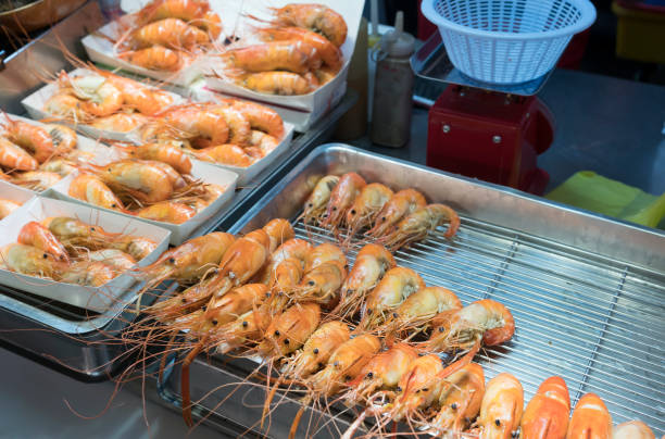 Delicious grilled Prawns selling on Feng Chia night market , street food market in Taichung , Taiwan Delicious grilled Prawns selling on Feng Chia night market , street food market in Taichung , Taiwan taiwan food prawn snack stock pictures, royalty-free photos & images