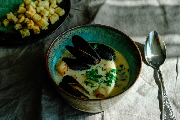 Delicious homemade chowder seafood soup with mussels and scallops. stock photo