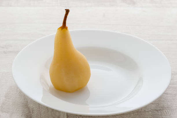 delicious poached pear stock photo