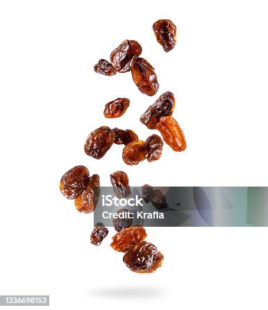 istock Delicious raisin in the air isolated on white background 1336698153