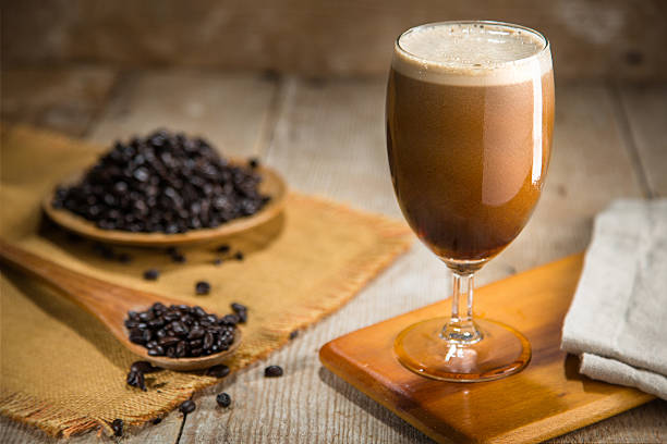 Delicious serving of fresh nitro coffee from tap organic ingredients stock photo