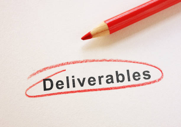 Deliverables text circled in red pencil on paper stock photo