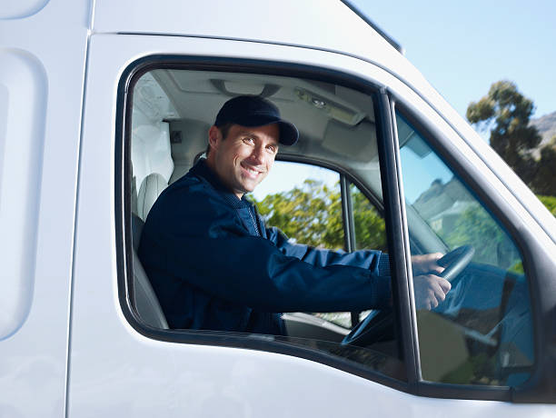 Delivery person driving van  commercial land vehicle stock pictures, royalty-free photos & images