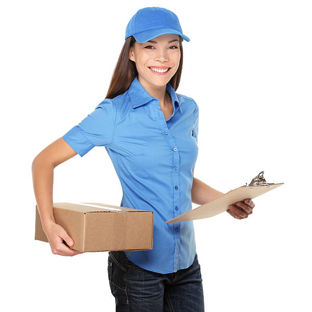 Delivery woman holding a package stock photo