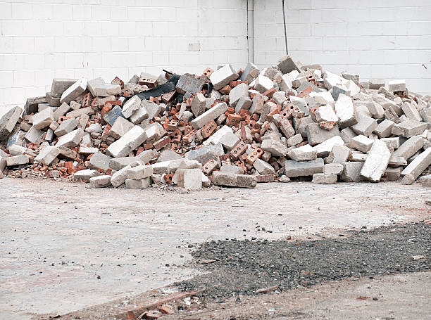 Demolition Rubble A pile of old damaged bricks and concrete blocks. ruined stock pictures, royalty-free photos & images