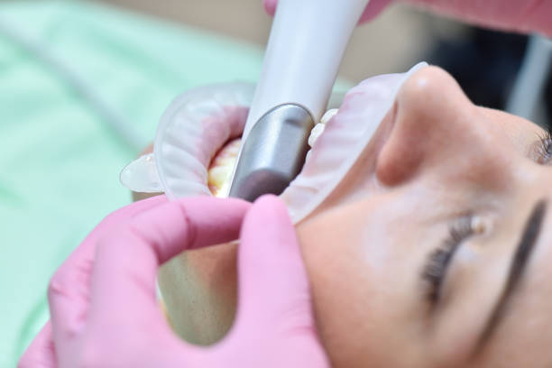 Dentist using 3D intraoral scanner for scanning teeth patient's. stock photo