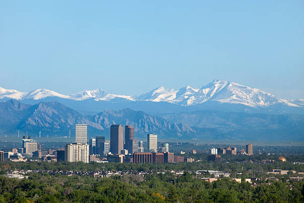 Denver Colorado skyscrapers snowy Longs Peak Rocky Mountains copy space stock photo