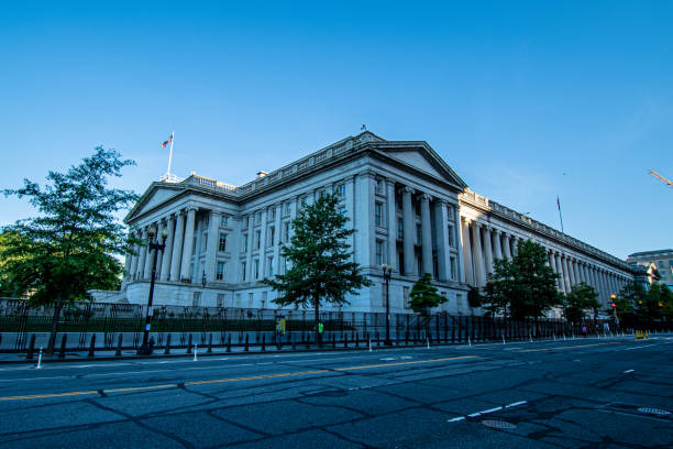 US Department of the Treasury surrounded by security fence. Washington, DC, USA, June 8 2020.  The Treasury building is enclosed behind the barricade erected by the Administration to protect the White House compound.  Nonetheless, the Treasury has been tagged by graffiti artists. bowser stock pictures, royalty-free photos & images
