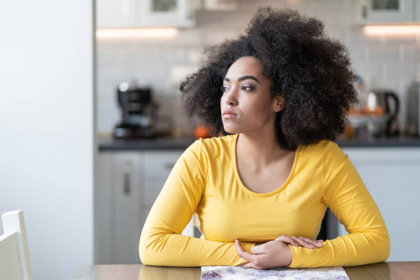 Depressed afro woman at home  introspection stock pictures, royalty-free photos & images