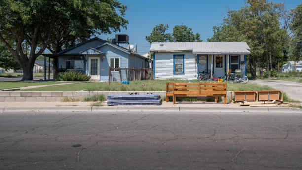 Depressed Housing in Hobbs, New Mexico Hobbs, New Mexico, USA - September 07, 2017:  The small city of Hobbs contains a number of depressed dwellings.  This is often contributed to the boom and bust cycle of the oil industry.  Pictured here are the front facades of single family units. run down stock pictures, royalty-free photos & images