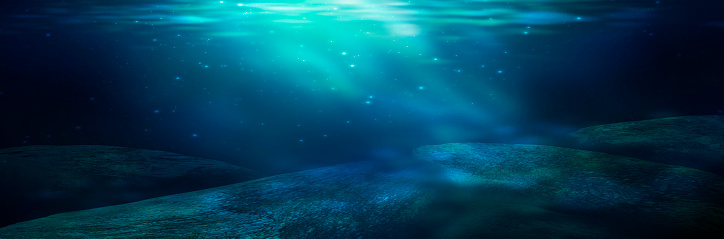 Depth of sea water, the bottom of the sea, the rays of the sun through the water, the underwater world, dark sea the background. Rocks and stones under water. Sea sand. 3D render.