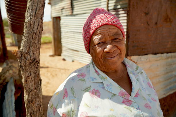 Descendants of the Kalahari Bushmen, at her tin home near the Transfrontier park. stock photo