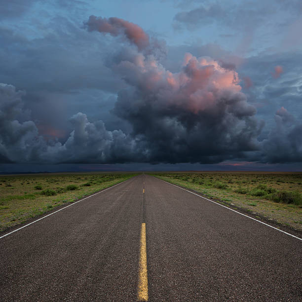 XXL desert road thunderstorm stock photo