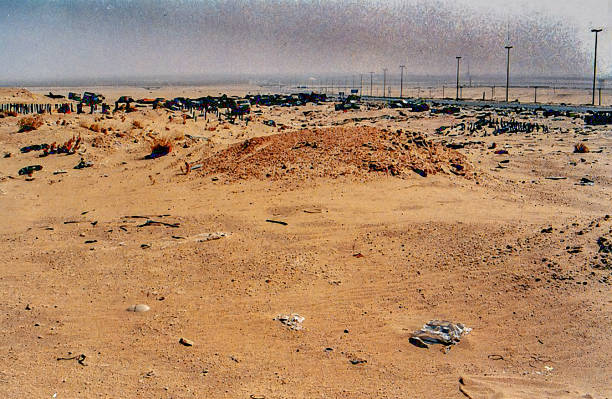 Desert Storm - War Zone Kuwait The series of images were taken in the War Zone of Kuwait by Desmond Stagg just after Desert Storm (17 January 1991 – 28 February 1991) had taken place. I cannot remember the exact date and time when I took the pictures but it was sometime in 1991. The images show the remains of war equipment left by the Iraqis on their hasty retreat back to Irak. Untold amounts of weapons, grenades, tanks, howitzers, vehicles as well as ammunition were left abandoned in the desert. Nearly all the ammunition was still live and dangerous.
The date created, below is the date the images were processed. They have remained on my hard disk since the end of Desert Storm. Up until now they are unpublished.
In some of the images the sky was grey from the smoke covering the blue sky and sunshine.  This was caused by the fires at the oil wells the invading troops had set.
Image #14 shows the spillage of oil caused by the supply lines being opened allowing the oil to escape and soil the desert ground. 1991 stock pictures, royalty-free photos & images