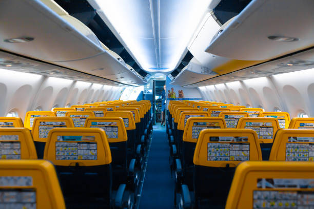 Deserted aircraft cabin. Rows of seats without passengers Deserted aircraft cabin. Rows of seats without passengers Lviv, Ukraine - 05.15.2019. lviv photos stock pictures, royalty-free photos & images