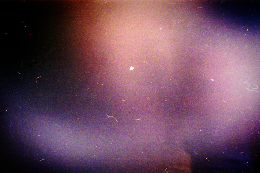 Designed film background with heavy grain, dust and light leak