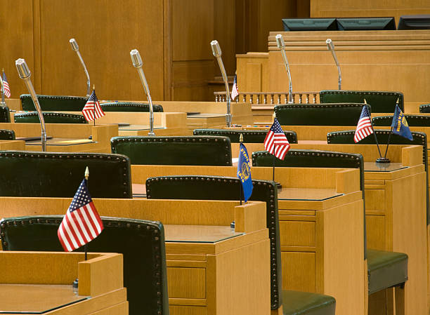 Desks with Flags and Microphones for Oregon House of Representatives stock photo