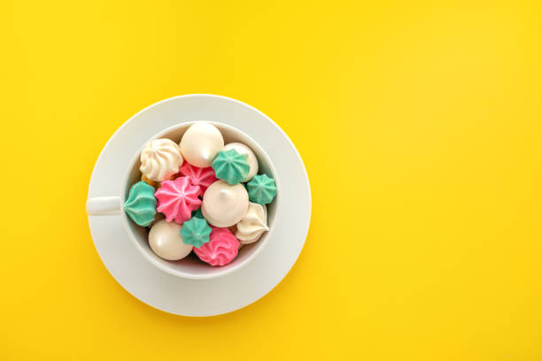 Dessert Background. Colorful Meringue flat lay. Top view of sweet meringues stock photo