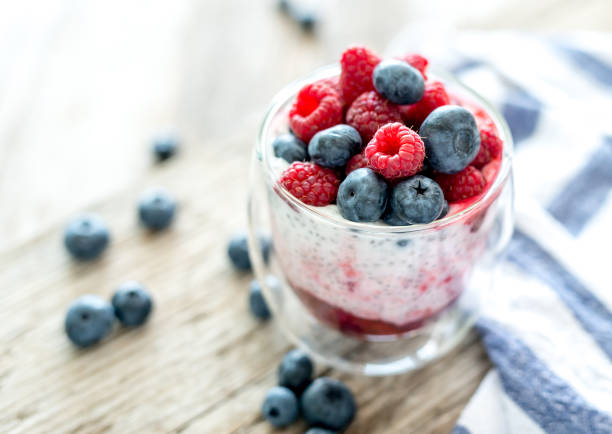 Dessert from yogurt with chia seeds, raspberries and blueberries stock photo