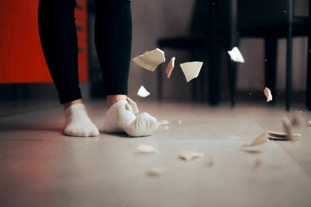 Detail of a Plate Falling on the Floor Breaking into Pieces stock photo
