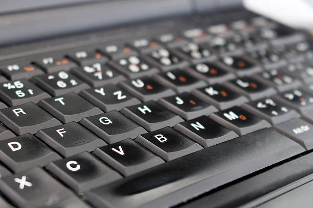 Detail of black laptop keyboard at office stock photo