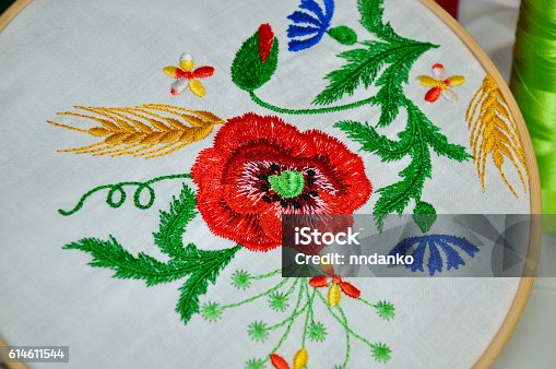 istock Detail of embroidery flower ornament in wooden hoop 614611544