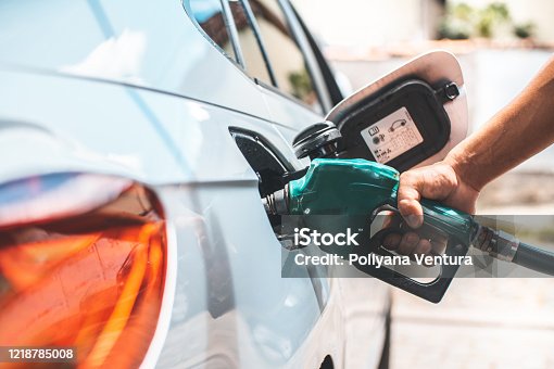istock Detail of hand filling the fuel tank 1218785008