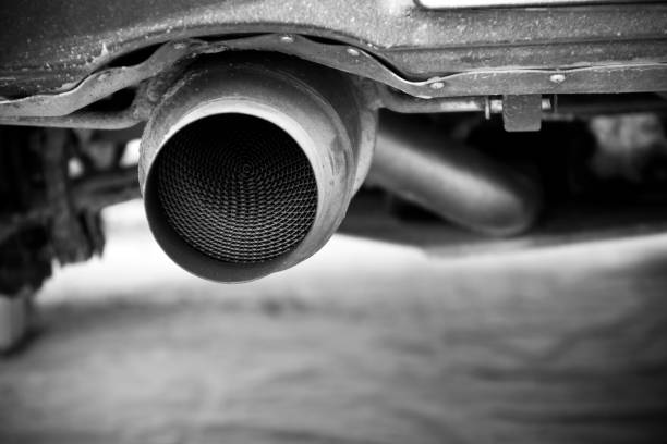 A detail of the end of a rally car´s exhaust. A detail of the end of a rally car´s exhaust. plug adapter stock pictures, royalty-free photos & images
