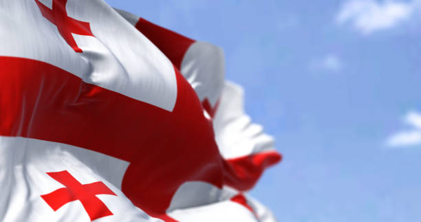 Detail of the national flag of Georgia waving in the wind on a clear day stock photo