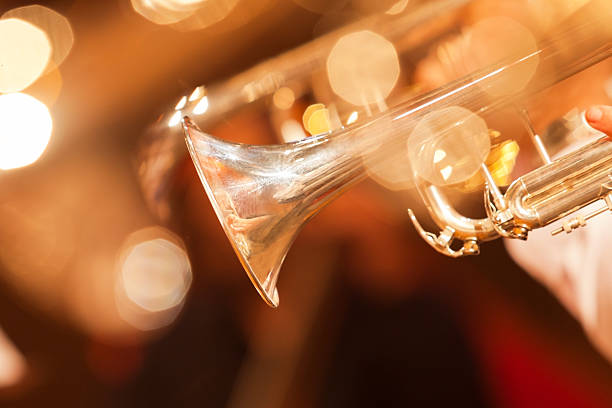 Detail of the trumpet closeup Detail of the trumpet closeup in golden tones wind instrument stock pictures, royalty-free photos & images
