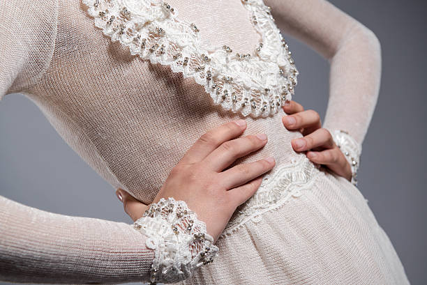 Detail of white elegant knitted dress