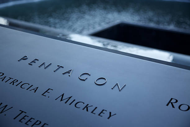 Detail view of the 9/11 Memorial in New York New York City, USA - December 29, 2011:  Late afternoon winter view of the 9/11 Memorial located at the World Trade Center site in lower Manhattan, New York City. The stark memorial lists the names of 2,977 victims of the terrorist attack of September 11, 2001, including the employees at the Pentagon in Arlington, VA near Washington, DC. 911 memorial stock pictures, royalty-free photos & images