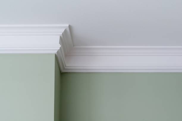 Details in the interior. Ceiling moldings, part of intricate corner. Details in the interior. Ceiling moldings, part of intricate corner moulding trim stock pictures, royalty-free photos & images