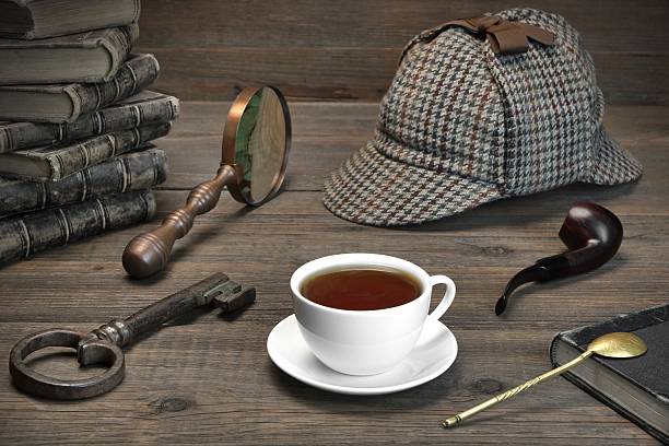 Detecrive or Investigation Concept.  Tools On The Wood Table Sherlock Holmes Concept. Private Detective Tools On The Wood Table Background. Deerstalker Cap,  Magnifier, Key, Cup, Notebook, Smoking Pipe. sherlock holmes stock pictures, royalty-free photos & images