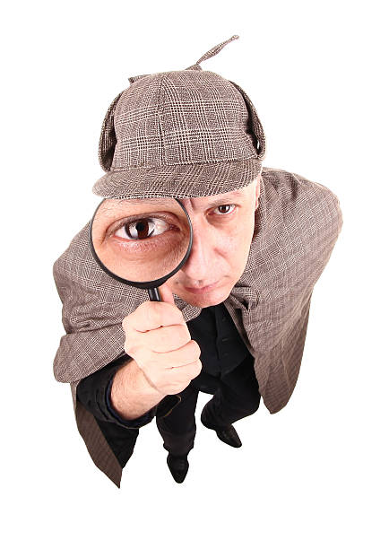 Detective Sherlock Holmes investigate with magnifying glass This detective is investigating case with magnifying glass. sherlock holmes stock pictures, royalty-free photos & images