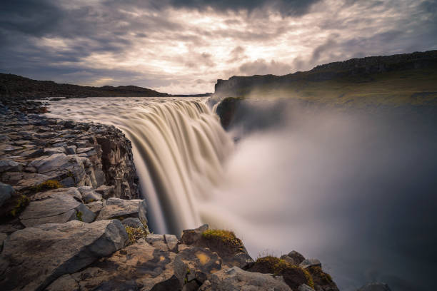 Dettifoss waterfall located on the Jokulsa a Fjollum river in Iceland Dettifoss waterfall located on the Jokulsa a Fjollum river in Iceland. Dettifoss is the second most powerful waterfall in Europe after the Rhine Falls. Long exposure. iceland dettifoss stock pictures, royalty-free photos & images