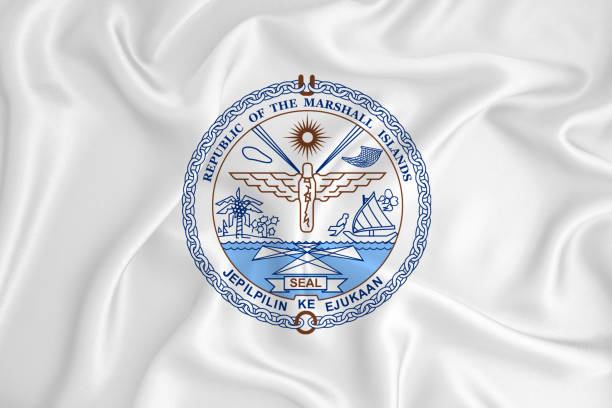 A developing white flag with the coat of arms of Marshall Islands. Country symbol. Illustration. Original and simple coat of arms in official colors and the right proportion A developing white flag with the coat of arms of Marshall Islands. Country symbol. Illustration. Original and simple coat of arms in official colors and the right proportion marshall photos stock pictures, royalty-free photos & images