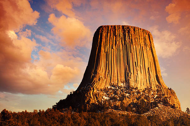 Devil's Tower at Sunset Sunset at Devil's Tower in Wyoming, USA. Noise added. natural landmark stock pictures, royalty-free photos & images