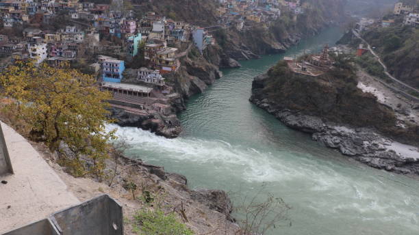 Devprayag the sangam of Alaknanda and Bhagirathi rivers Devprayag of Uttarakhand, is one of the Panch Prayag (five confluences) of Alaknanda River where Alaknanda and Bhagirathi rivers meet and take the name Ganges River. ganga river stock pictures, royalty-free photos & images
