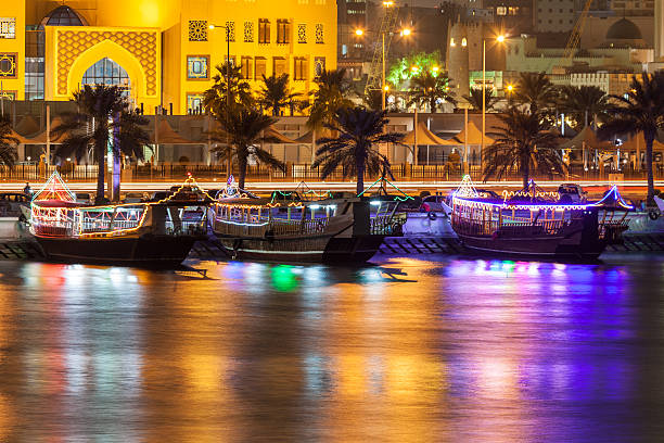 Dhows in Doha, Qatar Cruise dhows at the corniche of Doha at night. Qatar, Middle East dhow stock pictures, royalty-free photos & images