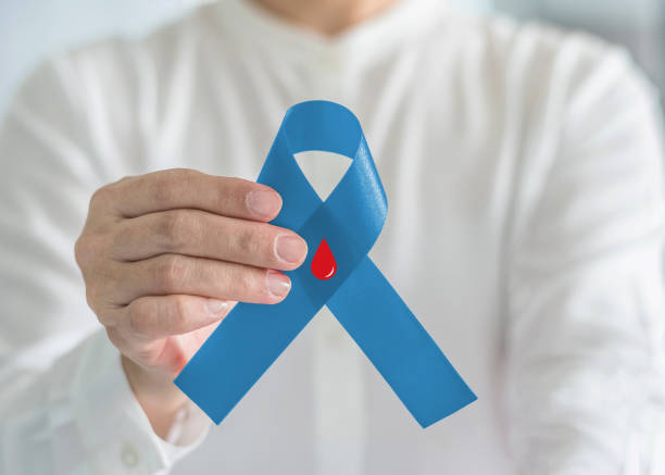 Diabetes Awareness ribbon for World diabetes day with red blood drop on blue bow color in person hand for supporting patient with diabetic disease Diabetes Awareness ribbon for World diabetes day with red blood drop on blue bow color in person hand for supporting patient with diabetic disease diabetes awareness month stock pictures, royalty-free photos & images