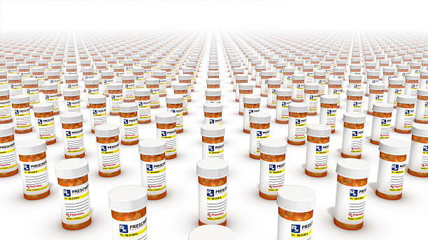 Diagonal high angle view of Pill Bottles Endless Pill Bottles xanax pills stock pictures, royalty-free photos & images