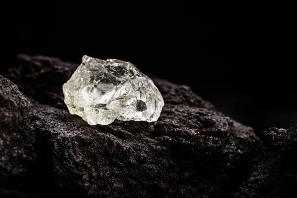 diamond mine with rough stones on kimberlite ore, diamond mining concept stock photo